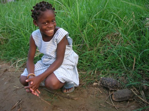 Young girl with a Home's Hingeback in Benin